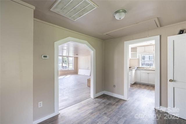 interior space with hardwood / wood-style floors and sink