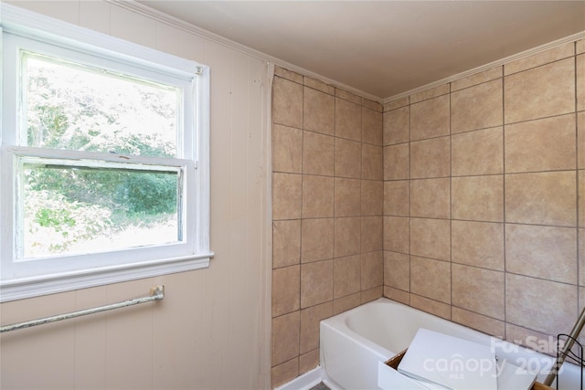 bathroom featuring a tub and ornamental molding