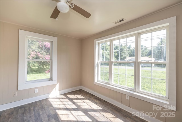 unfurnished room featuring dark wood-type flooring