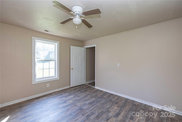 unfurnished room featuring dark hardwood / wood-style floors and ceiling fan