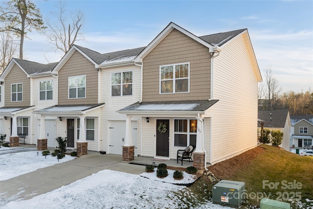 view of front of house featuring covered porch and a garage