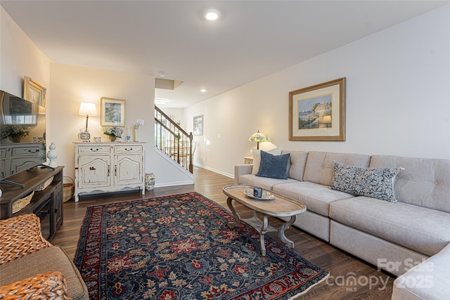 living room with stairs, recessed lighting, wood finished floors, and baseboards