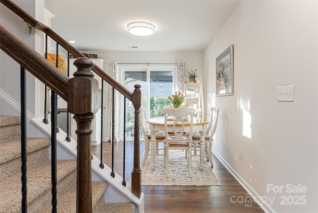 unfurnished dining area with dark hardwood / wood-style floors