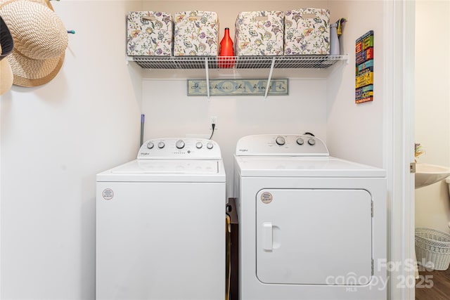 laundry area with independent washer and dryer