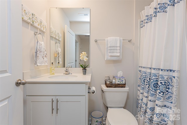 bathroom with toilet and vanity