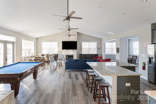 playroom with ceiling fan, lofted ceiling, pool table, and dark hardwood / wood-style floors