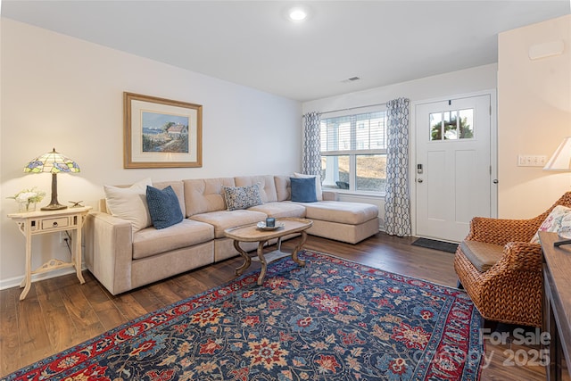 living room featuring dark hardwood / wood-style floors