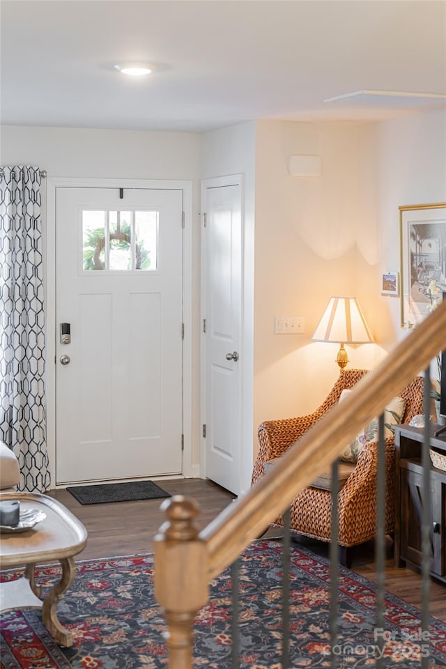 foyer with dark hardwood / wood-style flooring