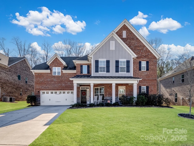 front of property with a garage, covered porch, and a front lawn