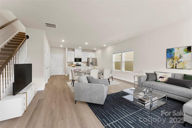 living room featuring light wood-type flooring