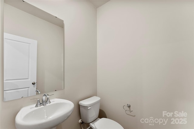 bathroom with sink and toilet