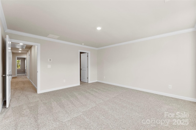 spare room featuring light carpet and ornamental molding