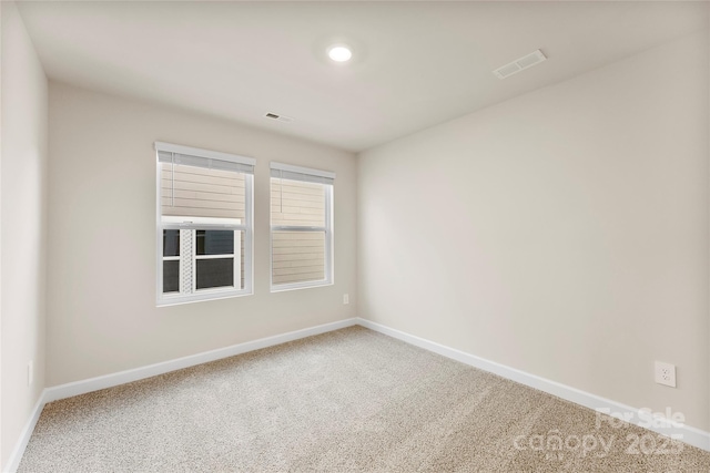 empty room featuring carpet flooring