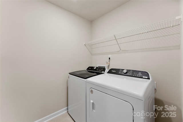 laundry room featuring washing machine and clothes dryer