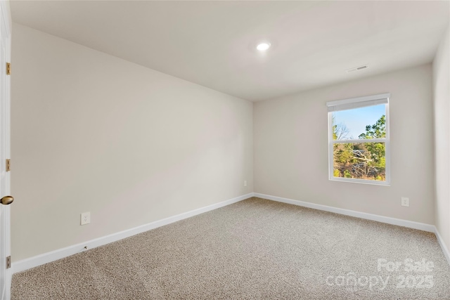 view of carpeted spare room