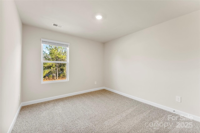 unfurnished room featuring carpet flooring