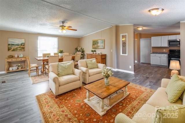 living room with a textured ceiling, ceiling fan, vaulted ceiling, and hardwood / wood-style flooring