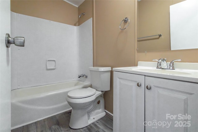 full bathroom with hardwood / wood-style floors, vanity,  shower combination, and toilet