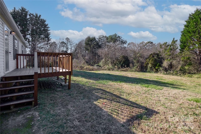 view of yard featuring a wooden deck