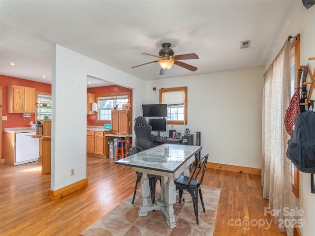 office featuring ceiling fan and light hardwood / wood-style flooring