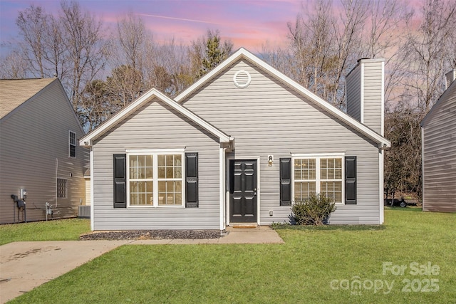 view of front of home with a yard