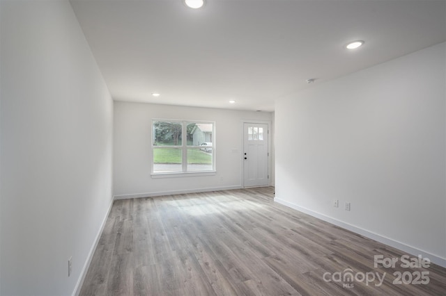 spare room with light hardwood / wood-style floors