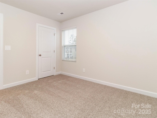 spare room featuring carpet flooring