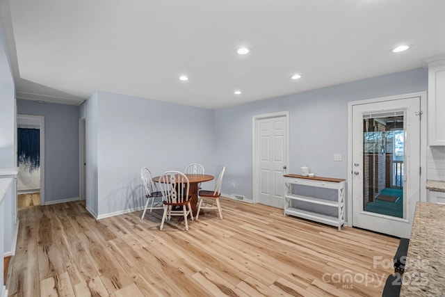 dining space featuring light hardwood / wood-style floors