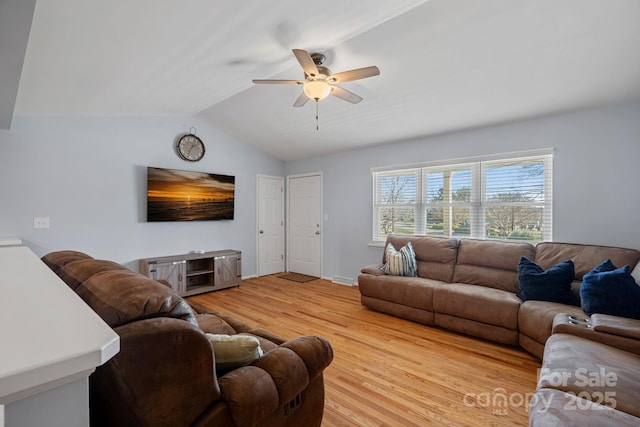 living room featuring light wood-type flooring, ceiling fan, and lofted ceiling