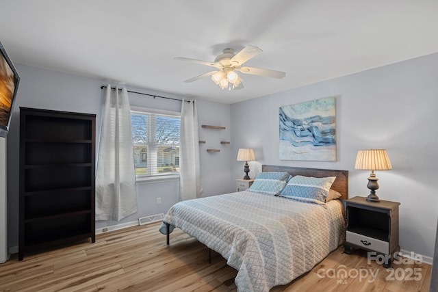 bedroom featuring hardwood / wood-style flooring and ceiling fan