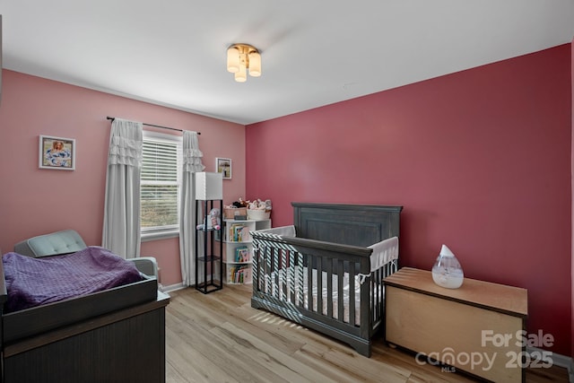 bedroom with light hardwood / wood-style floors