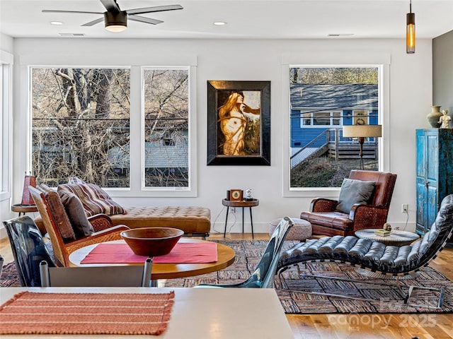 sitting room featuring hardwood / wood-style flooring and ceiling fan