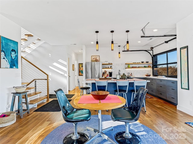 dining area with light hardwood / wood-style flooring