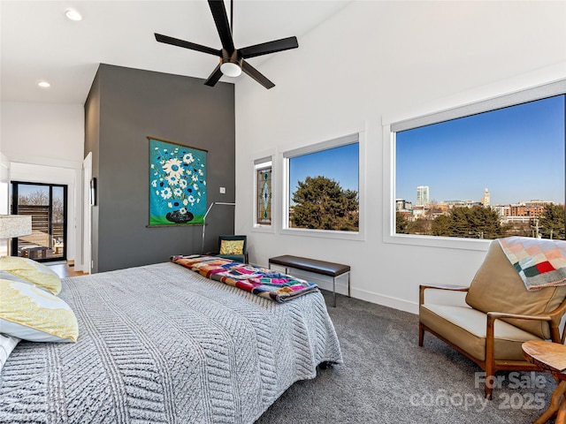 bedroom featuring carpet flooring, ceiling fan, and vaulted ceiling