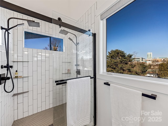 bathroom with a shower with shower door