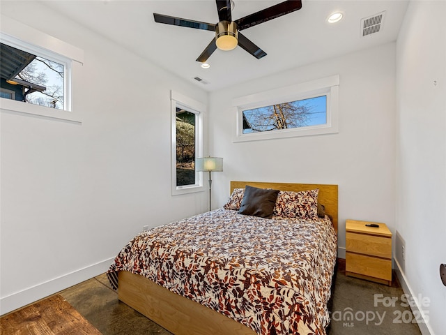 bedroom with multiple windows and ceiling fan