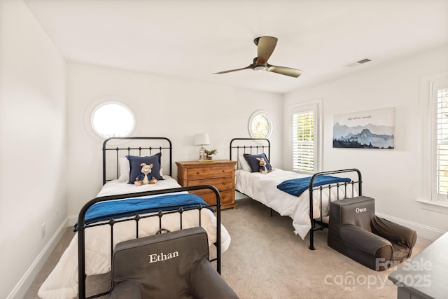 carpeted bedroom with ceiling fan