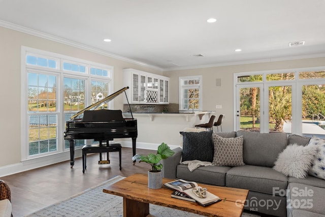 living room featuring ornamental molding and hardwood / wood-style flooring