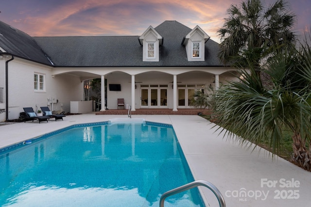 view of pool featuring ceiling fan and a patio