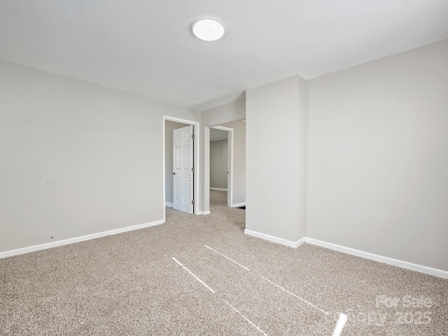 spare room featuring carpet floors