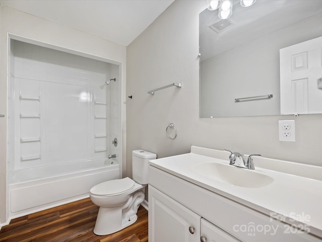 full bathroom with vanity, toilet, wood-type flooring, and bathtub / shower combination