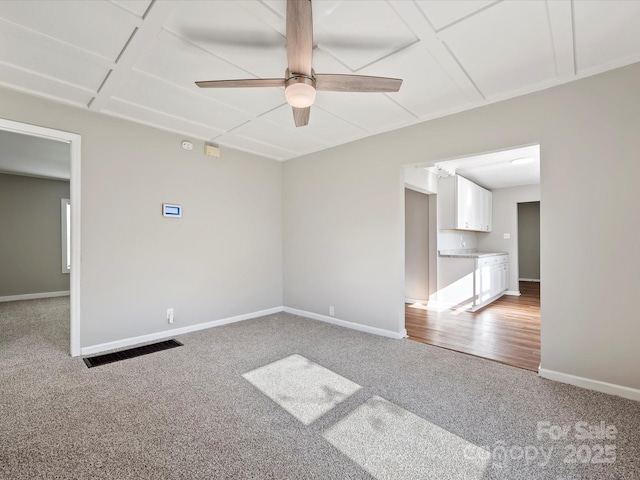 carpeted empty room with ceiling fan