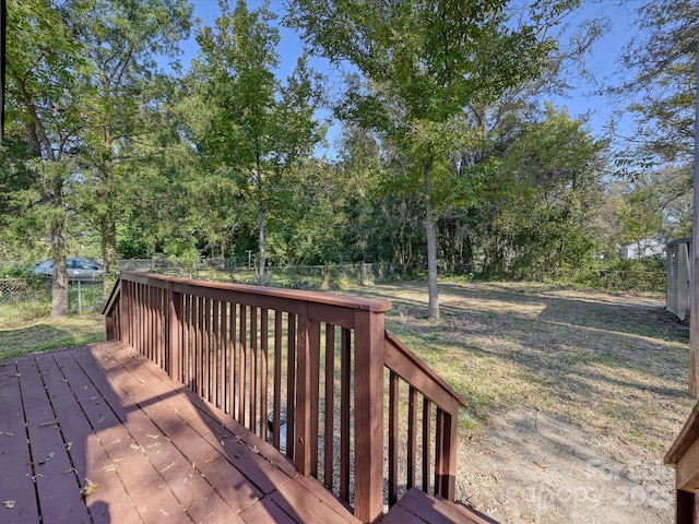 wooden terrace with a yard