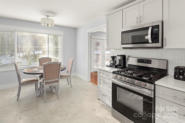 kitchen featuring appliances with stainless steel finishes and white cabinets