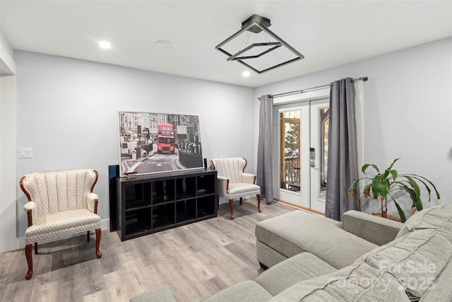 living room with light hardwood / wood-style flooring