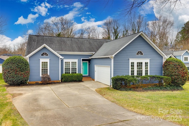 single story home featuring a garage and a front yard