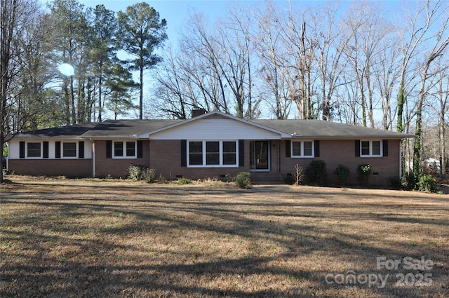 ranch-style home with a front lawn