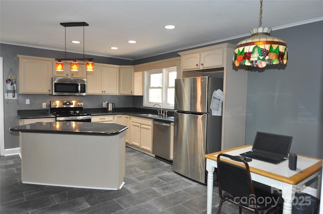 kitchen featuring a center island, sink, stainless steel appliances, pendant lighting, and ornamental molding