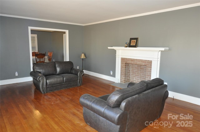 living room with a fireplace, wood-type flooring, and crown molding