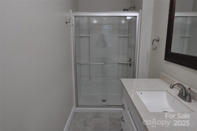 bathroom with vanity and an enclosed shower